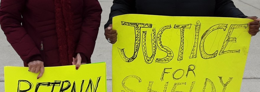 Kathy Montgomery (left) and Kinda McKinney-Anderson (Right) hold vigil outside courthouse on April 4, 2023.